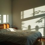A bedroom with shifting light and warped surfaces, highlighting how temperature variability can affect the comfort and atmosphere of a sleep environment.